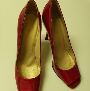 Stuart Weitzman red patent leather shoes.